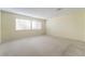 Large bedroom with neutral walls and carpet at 2422 Paradise Village Way, Las Vegas, NV 89104