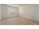 Simple bedroom with a window and neutral colored walls at 2422 Paradise Village Way, Las Vegas, NV 89104