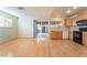 Bright kitchen with light wood cabinets, hardwood floors, and modern appliances at 2422 Paradise Village Way, Las Vegas, NV 89104