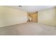 Living room with neutral carpeting and stairs at 2422 Paradise Village Way, Las Vegas, NV 89104