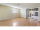 Light and airy living room with hardwood floors and sliding glass doors to the patio at 2422 Paradise Village Way, Las Vegas, NV 89104