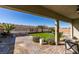 Landscaped backyard with covered patio and putting green at 2469 Cingoli St, Henderson, NV 89044