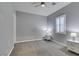 Bright bedroom with gray walls, carpet, and ceiling fan at 2469 Cingoli St, Henderson, NV 89044