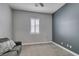 Cozy bedroom with gray walls, plush carpet, and window shutters at 2469 Cingoli St, Henderson, NV 89044