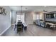 Bright dining area with a large wooden table and bench seating at 2469 Cingoli St, Henderson, NV 89044