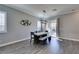 Dining area with modern light fixture, concrete table, and bench seating at 2469 Cingoli St, Henderson, NV 89044