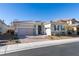 Single-story home with gray exterior, two-car garage, and landscaped front yard at 2469 Cingoli St, Henderson, NV 89044