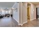 Bright hallway with wood-look floors, leading to living room and bathroom at 2469 Cingoli St, Henderson, NV 89044