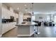 Modern kitchen with white cabinets, granite countertops and breakfast bar at 2469 Cingoli St, Henderson, NV 89044