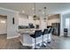 Modern kitchen with granite countertops, white cabinets, and breakfast bar at 2469 Cingoli St, Henderson, NV 89044