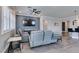 Relaxing living room with gray reclining sofas and wood-look floors at 2469 Cingoli St, Henderson, NV 89044