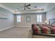 Large main bedroom with high ceilings, carpet, and a ceiling fan at 2469 Cingoli St, Henderson, NV 89044