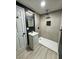 Contemporary bathroom with dark-accent walls, walk-in shower, and floating vanity at 2820 Richfield Blvd, Las Vegas, NV 89102