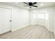 Spacious bedroom featuring gray flooring, bay window, and ceiling fan at 2820 Richfield Blvd, Las Vegas, NV 89102