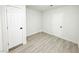 Simple bedroom with gray flooring and two white doors at 2820 Richfield Blvd, Las Vegas, NV 89102