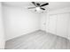 Bright bedroom with gray laminate flooring and mirrored closet doors at 2820 Richfield Blvd, Las Vegas, NV 89102