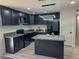 Modern kitchen with dark cabinetry, quartz countertops and island at 2820 Richfield Blvd, Las Vegas, NV 89102