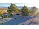 House with a large yard, firepit, and mountain backdrop at 2891 Oakleaf Ave, Pahrump, NV 89048