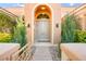 Elegant entryway with double doors and landscaping at 3016 Darby Falls Dr, Las Vegas, NV 89134