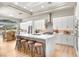 Modern kitchen featuring white cabinets and a large island at 3016 Darby Falls Dr, Las Vegas, NV 89134