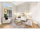 Living room with a neutral color scheme and large windows at 3016 Darby Falls Dr, Las Vegas, NV 89134