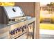 Stainless steel outdoor grill with built-in side burner at 3016 Darby Falls Dr, Las Vegas, NV 89134