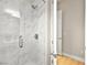 Large walk-in shower with marble tile at 3016 Darby Falls Dr, Las Vegas, NV 89134