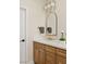 Sophisticated bathroom with a single sink, marble countertop, and updated fixtures at 3110 Scotts Valley Dr, Henderson, NV 89052