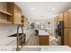 Modern kitchen with stainless steel appliances and light wood cabinets at 3110 Scotts Valley Dr, Henderson, NV 89052