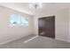 Well-lit bedroom with gray carpet and window at 3314 El Camino Real, Las Vegas, NV 89121