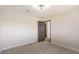 Bedroom with carpeted floor and dark door at 3314 El Camino Real, Las Vegas, NV 89121