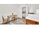 Kitchen features a small table and view of laundry room at 3434 Empress Diamond Dr, North Las Vegas, NV 89032