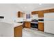 Kitchen with wood cabinets and stainless steel appliances at 3434 Empress Diamond Dr, North Las Vegas, NV 89032