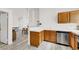 Kitchen with wood cabinets, stainless steel appliances and vinyl flooring at 3434 Empress Diamond Dr, North Las Vegas, NV 89032