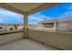 Private balcony with view of neighboring homes and blue sky at 3604 Lisandro St # 201, Las Vegas, NV 89108