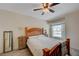 Cozy bedroom with wood bed frame and large window at 3604 Lisandro St # 201, Las Vegas, NV 89108