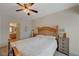 Bright bedroom with wood flooring and ceiling fan at 3604 Lisandro St # 201, Las Vegas, NV 89108