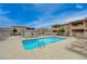 Community pool with lounge chairs and clear water at 3604 Lisandro St # 201, Las Vegas, NV 89108