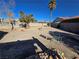 Large backyard with desert landscaping and seating area at 3830 Passionfruit St, North Las Vegas, NV 89032