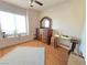 Bright bedroom with wood flooring and large window at 3830 Passionfruit St, North Las Vegas, NV 89032