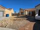 House exterior showcasing a front yard with gravel landscaping at 3830 Passionfruit St, North Las Vegas, NV 89032