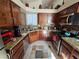 Well-equipped kitchen featuring granite countertops and ample wood cabinetry at 3830 Passionfruit St, North Las Vegas, NV 89032