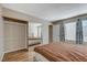 Bedroom featuring a sliding mirrored closet and a sunlit window at 4241 Gannet Cir # 205, Las Vegas, NV 89103