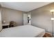 Bedroom with light colored walls, an open doorway, and a floor lamp at 4241 Gannet Cir # 205, Las Vegas, NV 89103