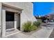 Close up exterior view of front door with security gate and desert landscaping at 4241 Gannet Cir # 205, Las Vegas, NV 89103