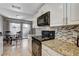 Kitchen and dining area with stainless steel appliances and a sliding door to patio at 4241 Gannet Cir # 205, Las Vegas, NV 89103