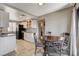 Kitchen and dining area with granite countertops, stainless steel appliances, and white cabinets at 4241 Gannet Cir # 205, Las Vegas, NV 89103