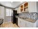 Bright kitchen with granite countertops, a mosaic backsplash, and a stainless-steel sink at 4241 Gannet Cir # 205, Las Vegas, NV 89103