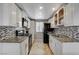 Kitchen with stainless steel appliances, backsplash, and white cabinetry at 4241 Gannet Cir # 205, Las Vegas, NV 89103