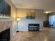 Living room with fireplace and tile floors, showcasing a neutral color palette at 4241 Gannet Cir # 205, Las Vegas, NV 89103